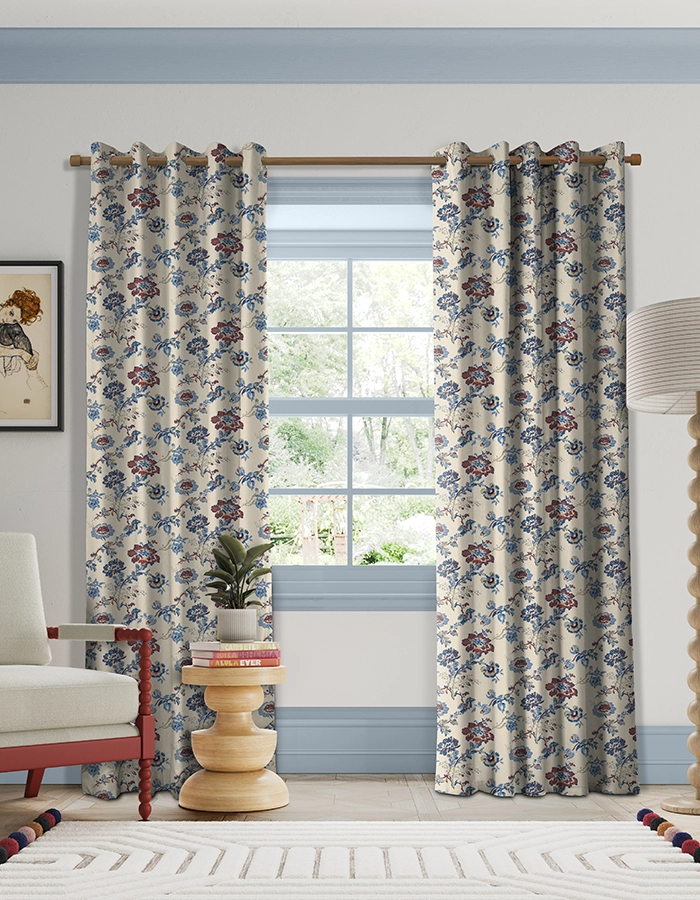 Room with red and blue flower curtains from Land & Shore
