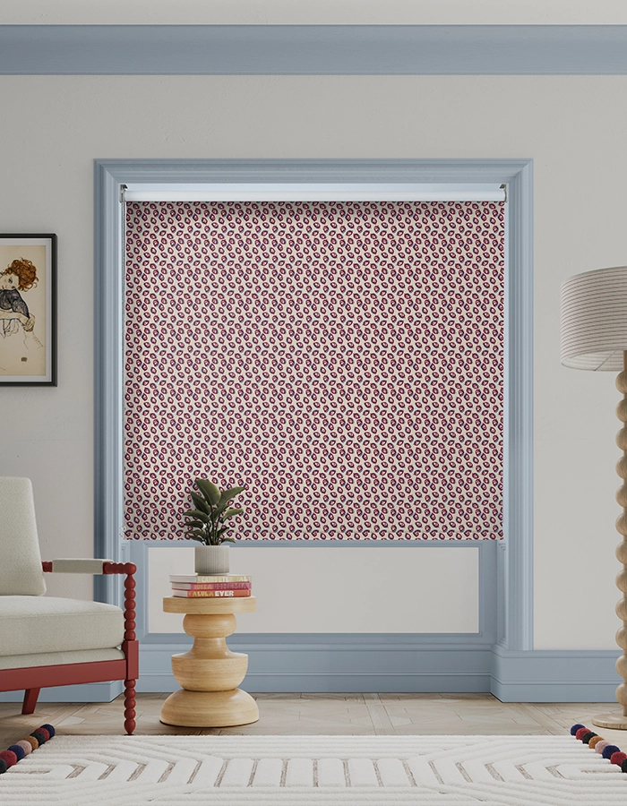 Room with red geometric roller blind from Land & Shore