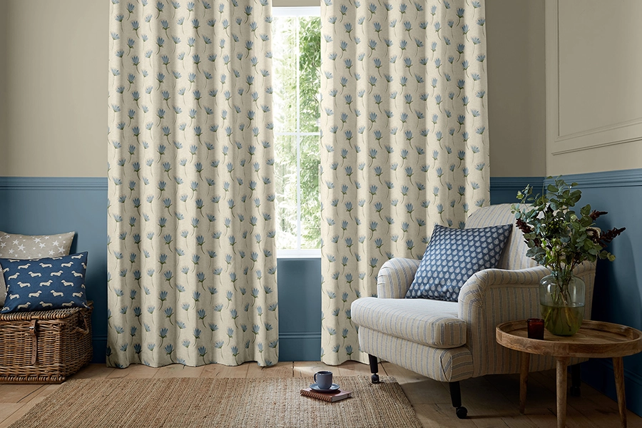 Room with blue floral curtain by Emily Bond