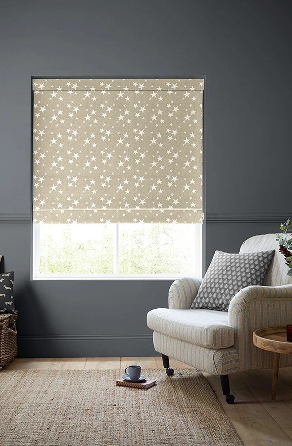 Room with white stars on natural colour background roman blind from Emily Bond