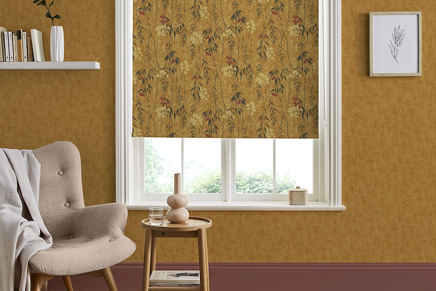 Room with orange floral roller blind from Graham & Brown