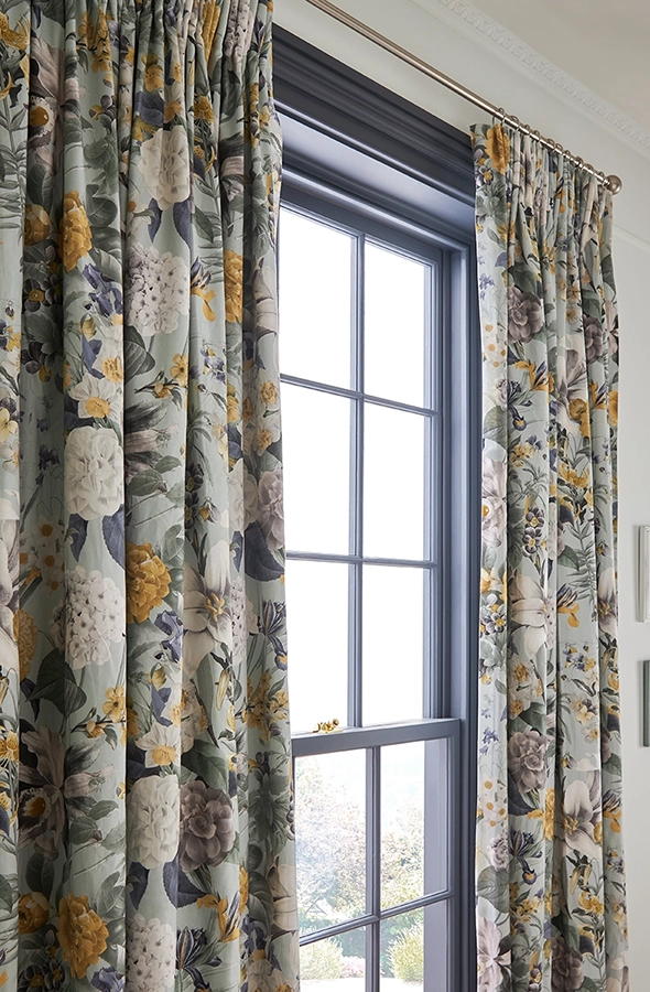 Room with light floral curtains from Graham & Brown