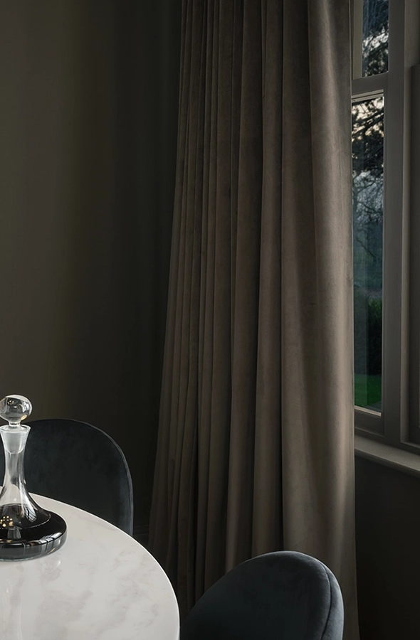 Room with plain green curtain from Graham & Brown