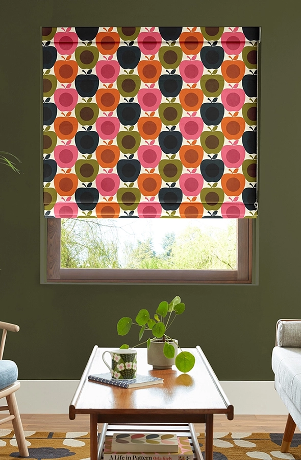 Room with pink apple design roman blind form Orla Kiely