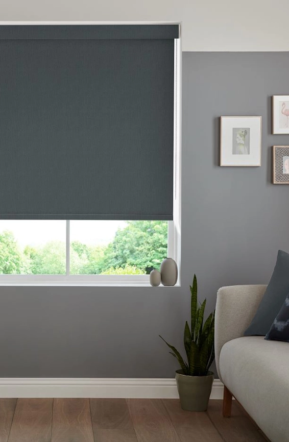 Room with dark grey roller blind from illumin8 Rollers Collection